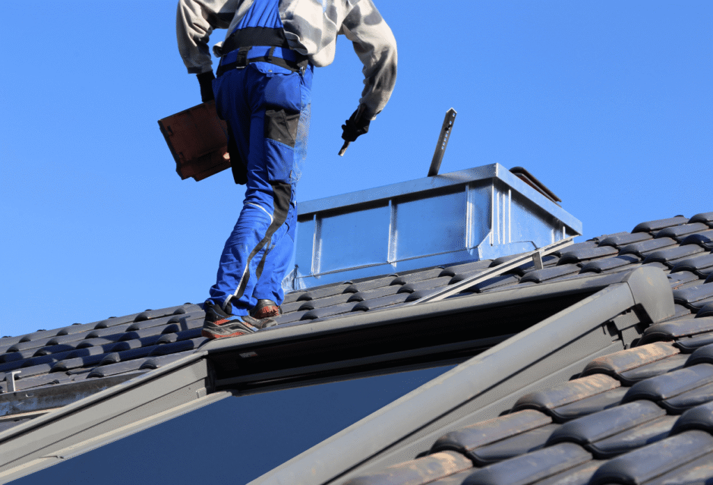 roofer completing a roof replacement