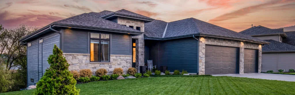 nice gray home with nice roof with nice lawn